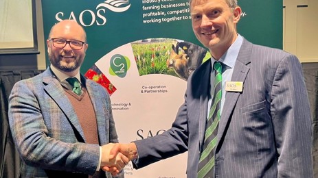 Two men from SOSE and SAOS shake hands to mark both organisations' new partnership